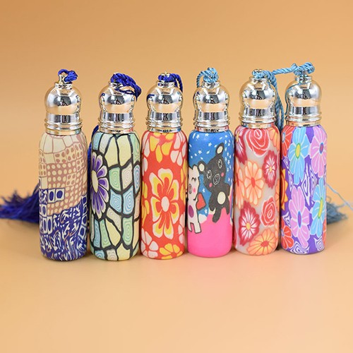 China Supplier Manufacture Cosmetic Polymer Clay Vial  Makeup Perfume Essential Oil Portable Refillable Roll On Ball Glass Jar with Tassel Cap