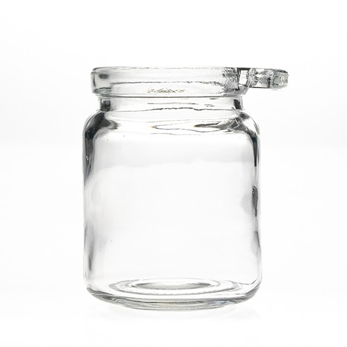 China Factory Supplier Food Honey Beehive Storage Round Clear Glass Bottle Jar with Wooden Spoon and Cork Stopper