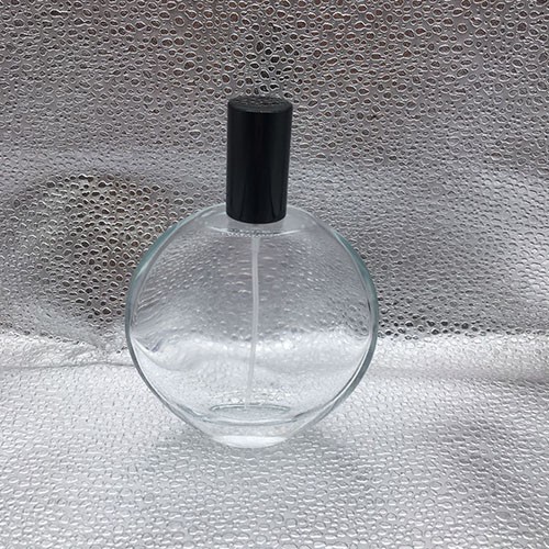 Wholesale 100 ML Transparent Flat Round Shape Perfume Glass Bottle with Pump Sprayer 